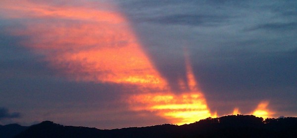 sunset with an angel looking at the past